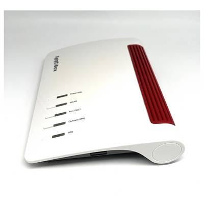Un routeur sans fil blanc et rouge avec des voyants indicateurs pour Alimentation/ADSL, WLAN, Fon/DECT, Connexion/WPS et Info, incliné sur un côté.