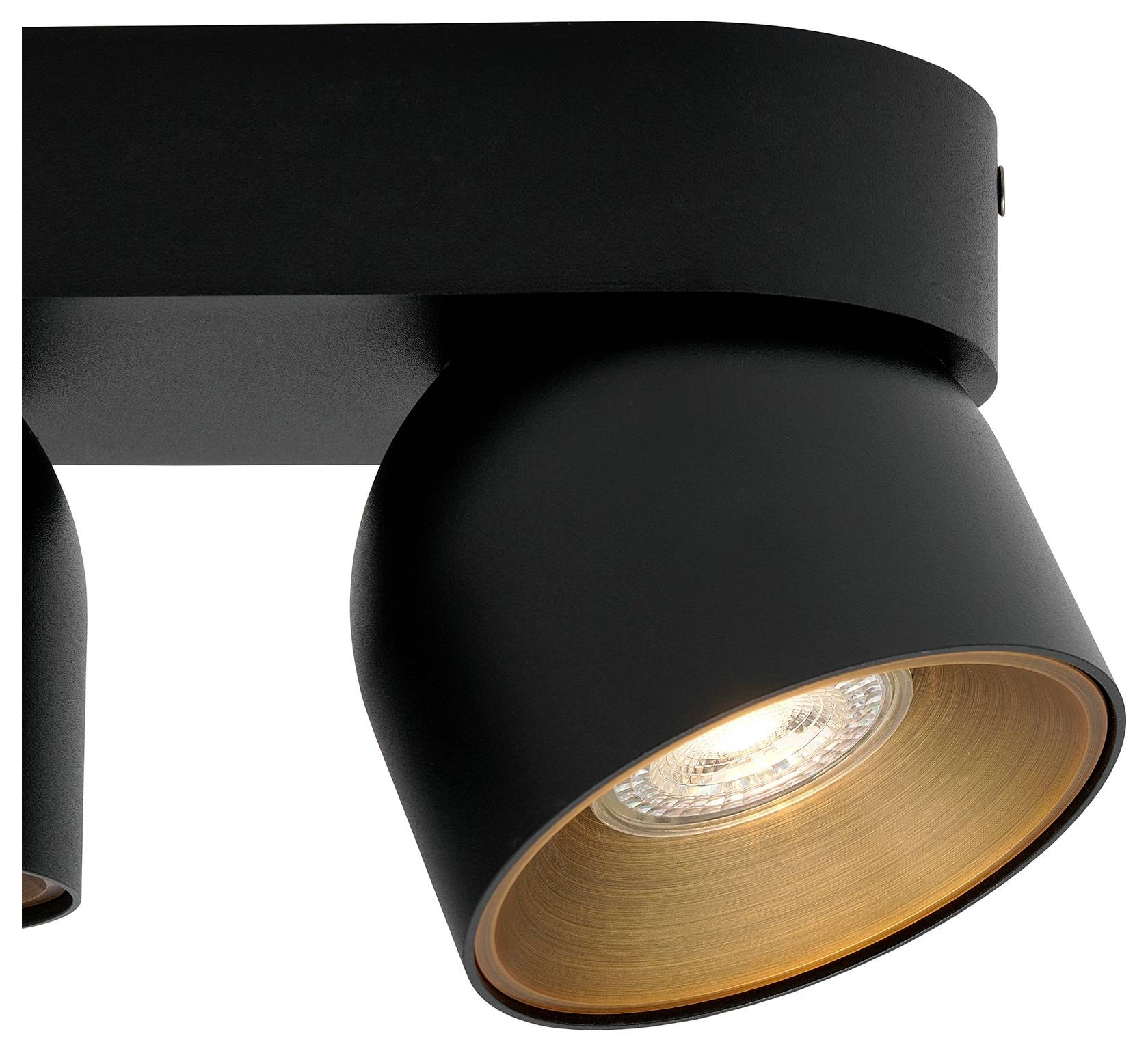 Gros plan d'un luminaire de plafond moderne de couleur noire avec une ampoule visible, émettant une lumière chaude, conçu pour une utilisation intérieure.