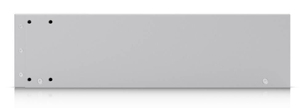 Un appareil électronique rectangulaire simple, gris argenté, avec des vis visibles sur son panneau frontal, probablement utilisé pour l'audio professionnel ou le réseau.