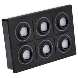 Un panneau rectangulaire noir avec six éléments ressemblant à des boutons circulaires, disposés en deux rangées de trois.