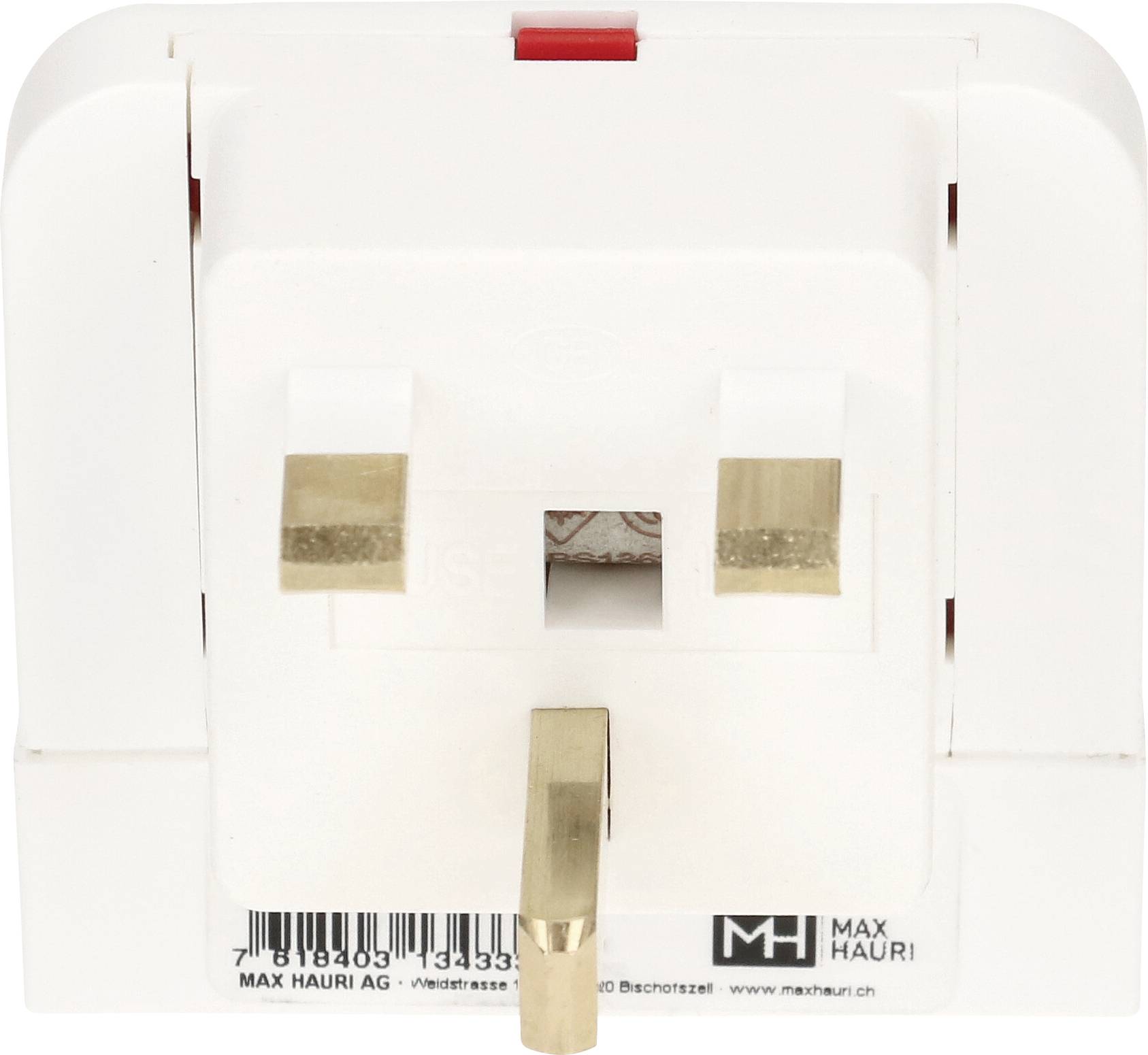 Un adaptateur de prise électrique blanc avec trois broches rectangulaires, adapté aux prises de courant britanniques. La marque au bas indique « Max Hauri ».