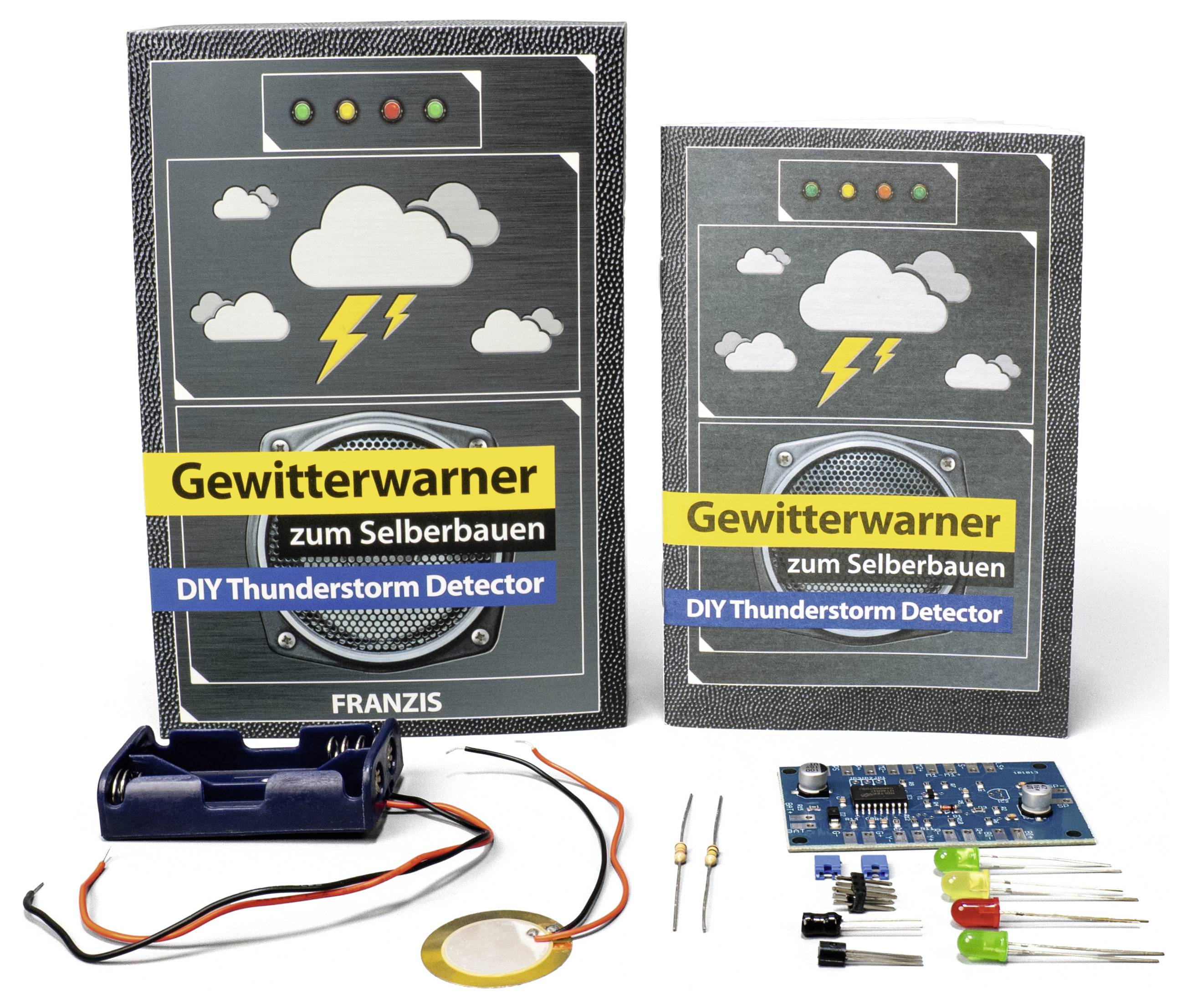 Kit « Détecteur d'Orage Fait Maison » montrant un manuel en allemand et en anglais, des composants électroniques incluant une carte de circuit et un câblage.