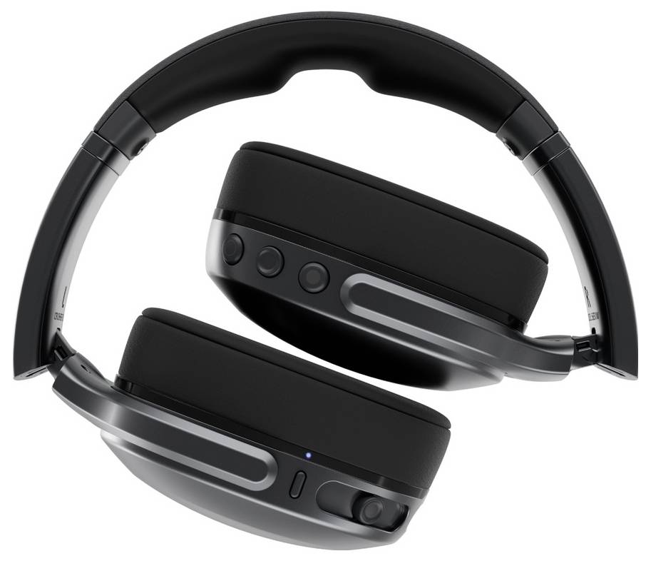 Une paire de casques audio sans fil supra-auriculaires noirs repliés pour un rangement compact, dotée de boutons de commande et d'accents argentés.