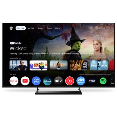 Interface utilisateur Smart TV affichant les icônes des applications de diffusion en continu et un film vedette, « Wicked », avec des options de navigation pour Films, Séries, Applications et Bibliothèque.