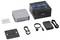 Kit mini PC Geekcom série GT avec l'ordinateur compact, boîte de marque, plaque de montage, adaptateur secteur, câble d'alimentation et accessoires HDMI/USB.