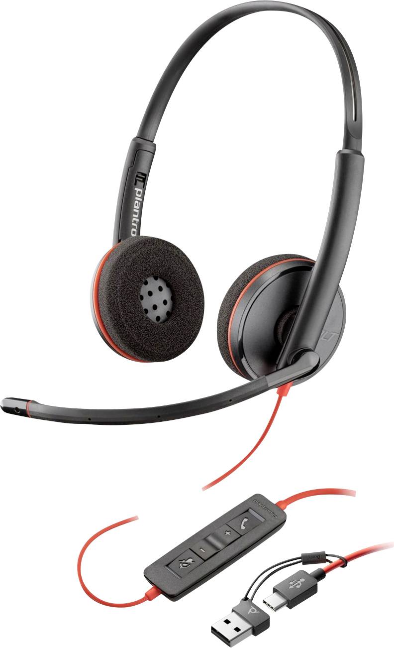 Un casque filaire noir et orange avec un bandeau ajustable, un microphone et un contrôle de volume en ligne. Comprend des connexions USB et une prise audio.