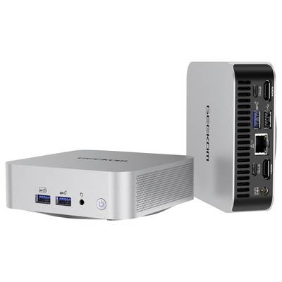 Deux petits PC miniatures Geekom en argent présentés de face et de dos, avec les ports USB, la prise casque, le bouton d'alimentation, Ethernet et les connexions HDMI visibles.
