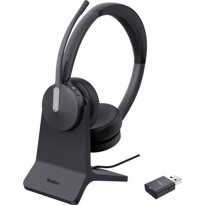 Un casque sans fil avec microphone, placé sur un socle de recharge à côté d'une clé USB, conçu pour la communication en mains libres.