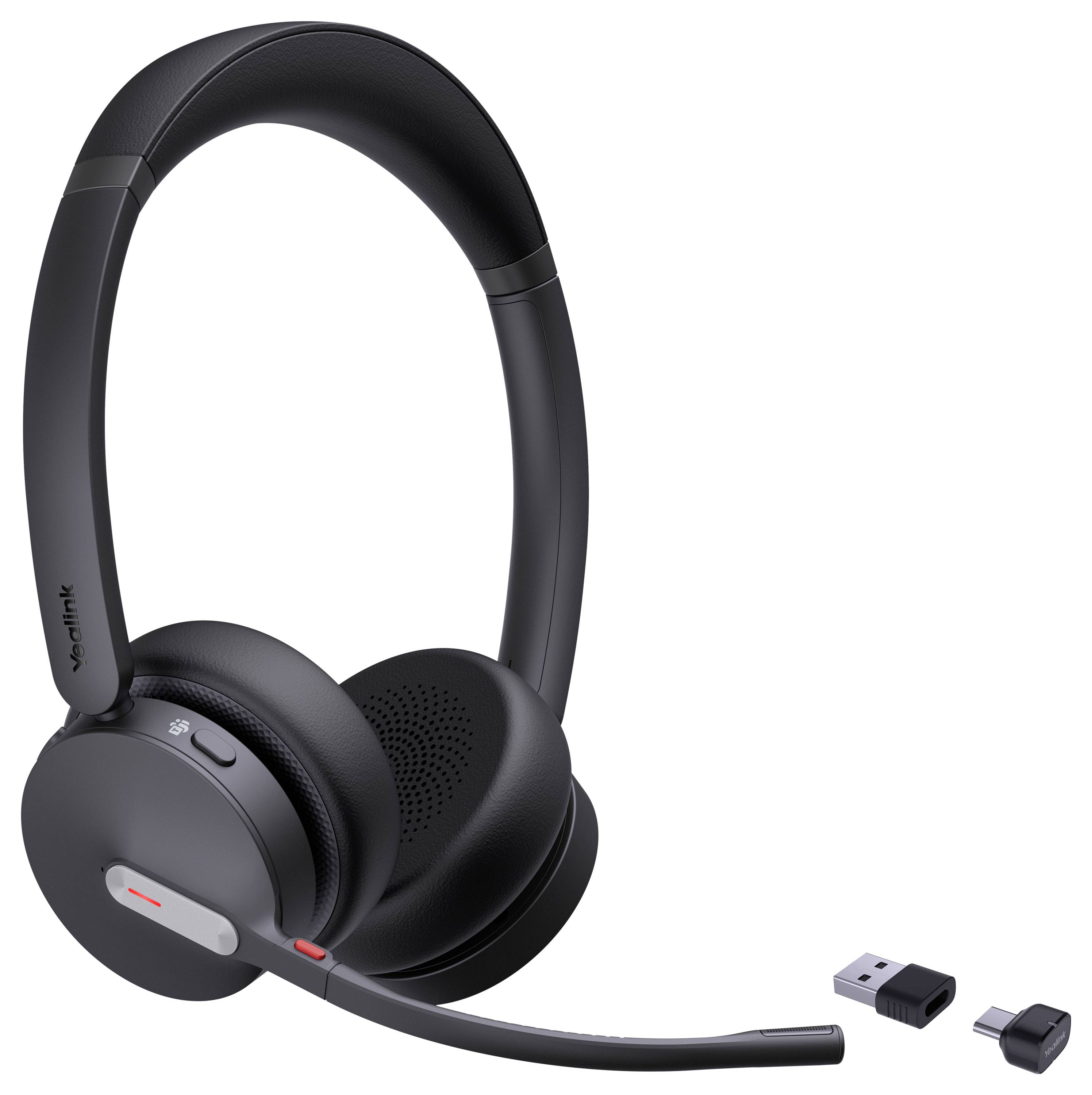 Casque sans fil noir avec design supra-auriculaire et microphone attaché, présenté avec dongle USB et récepteur pour la connectivité.
