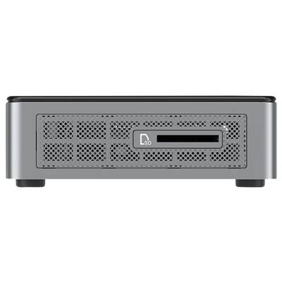 Vue de face d'un appareil électronique argenté avec une grille perforée, un petit écran et une fente pour carte SD sur le côté droit.