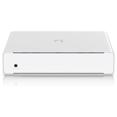 Un élégant appareil électronique blanc avec un petit logo sur le dessus et un unique port d'entrée étiqueté « Entrée CC » sur le devant.
