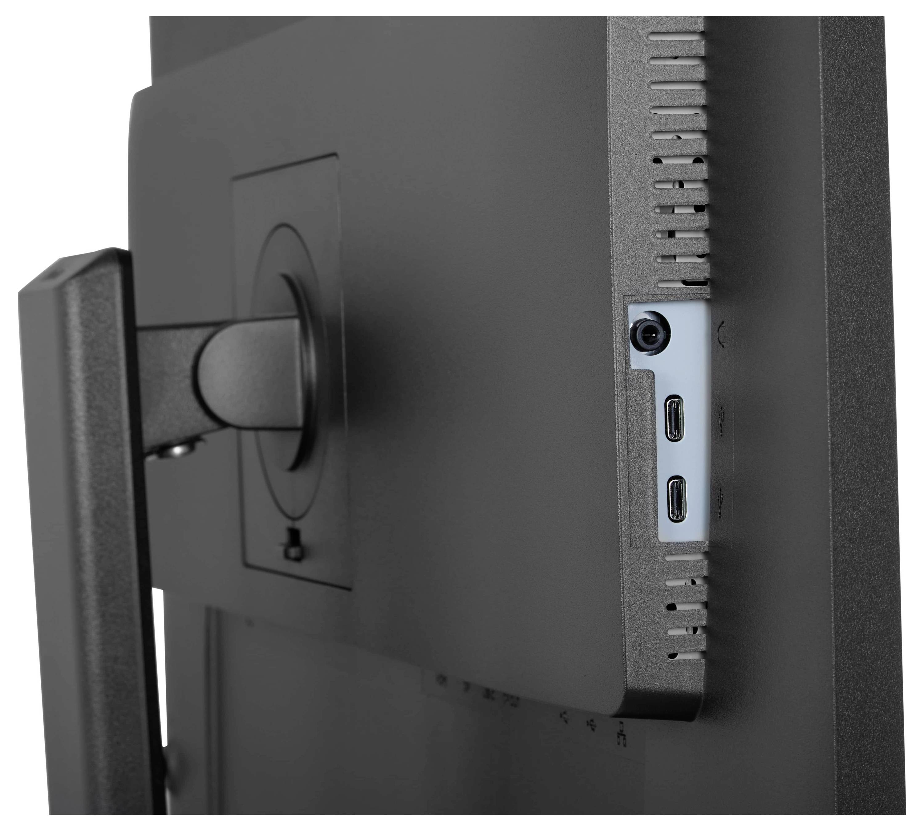 Une vue latérale de l'arrière d'un moniteur montrant ses ports USB et un support de montage attaché à un pied.