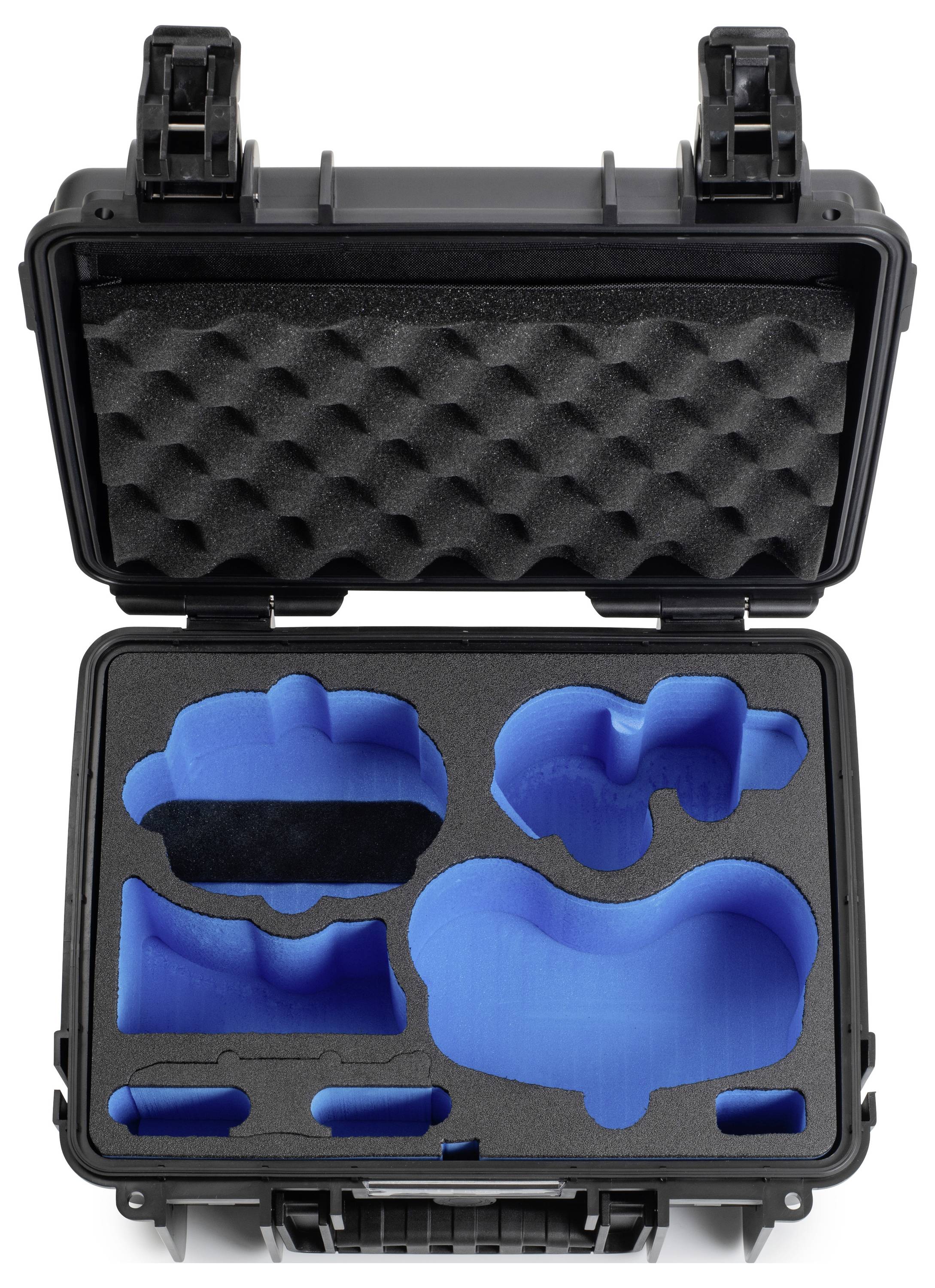 Boîtier de transport noir ouvert avec inserts en mousse bleu personnalisés, contenant des espaces façonnés pour divers équipements. Loquets présentés ouverts.