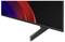 Gros plan d'un moniteur à écran plat avec une lunette et un socle noirs, affichant une vague abstraite rouge et bleu foncé sur l'écran.