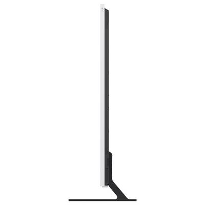 Moniteur noir et blanc mince affiché de côté sur un support, mettant en évidence son profil fin et sa base inclinée.