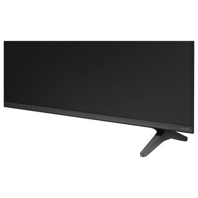 Gros plan d'un écran de moniteur LG UltraWide noir et de son support contre un fond blanc.