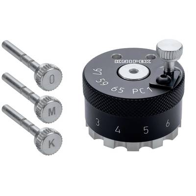 Outil en métal usiné avec des broches à pointe interchangeable et un cadran rotatif étiqueté avec des chiffres et 'KNOPB', probablement un appareil de réglage de précision ou de réglage de poinçon.