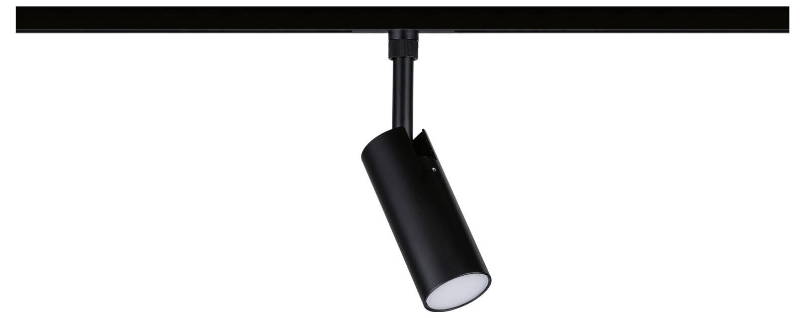 Luminaire sur rail cylindrique noir suspendu à un rail de plafond, orienté vers le bas et allumé.