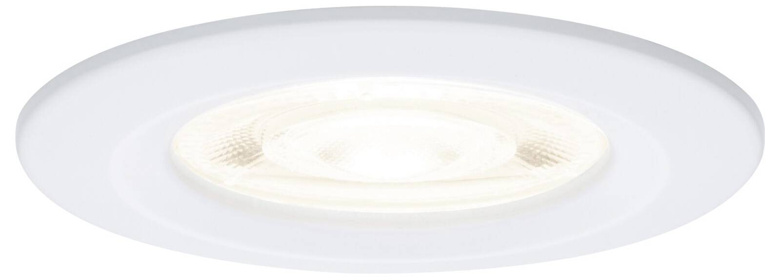 Un luminaire de plafond encastré blanc et rond, vu d'en bas.