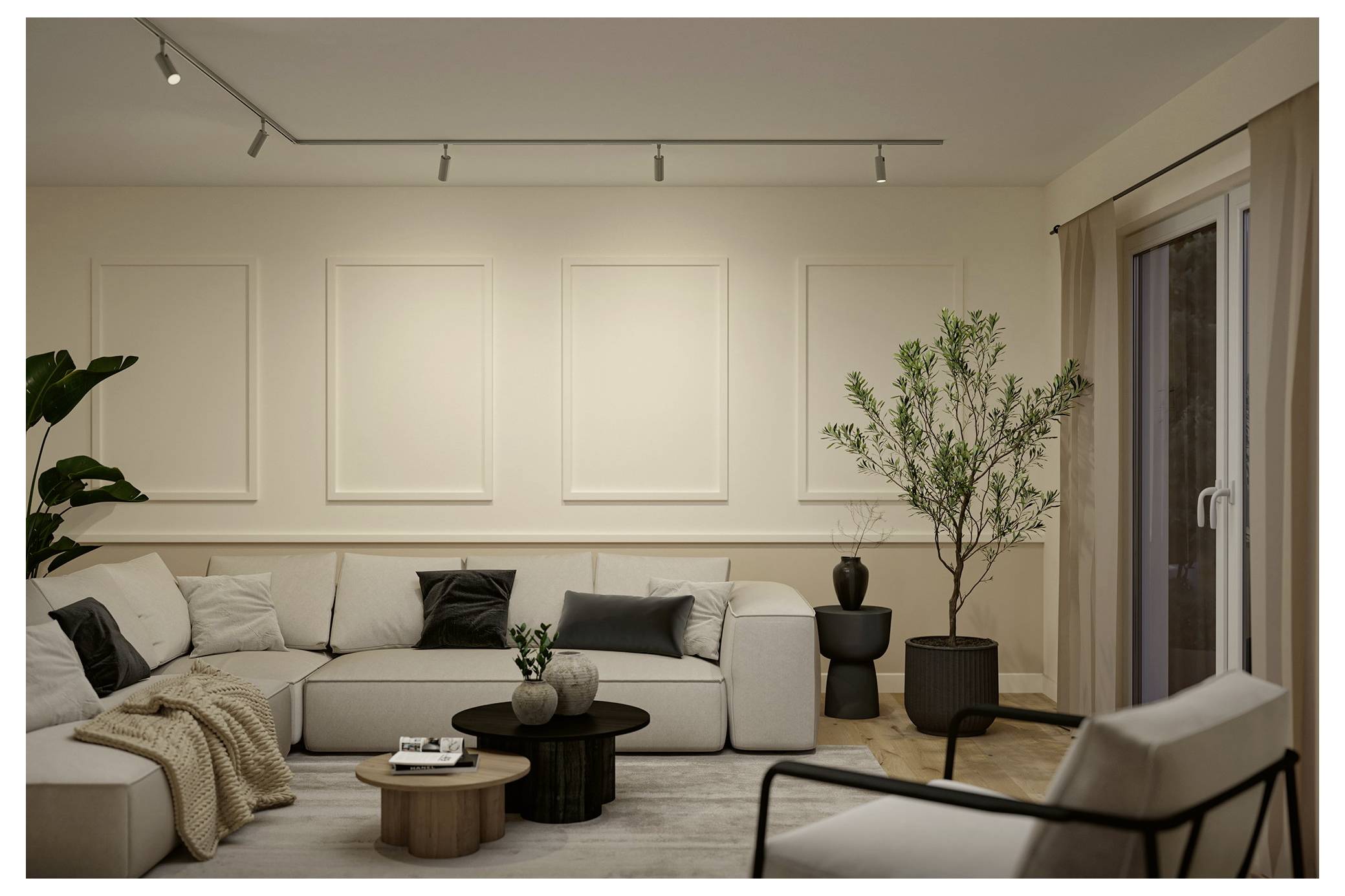 Salon minimaliste moderne avec un canapé sectionnel beige clair, des tables basses imbriquées, des plantes en pot et un éclairage sur rail à côté d'une porte-fenêtre coulissante.