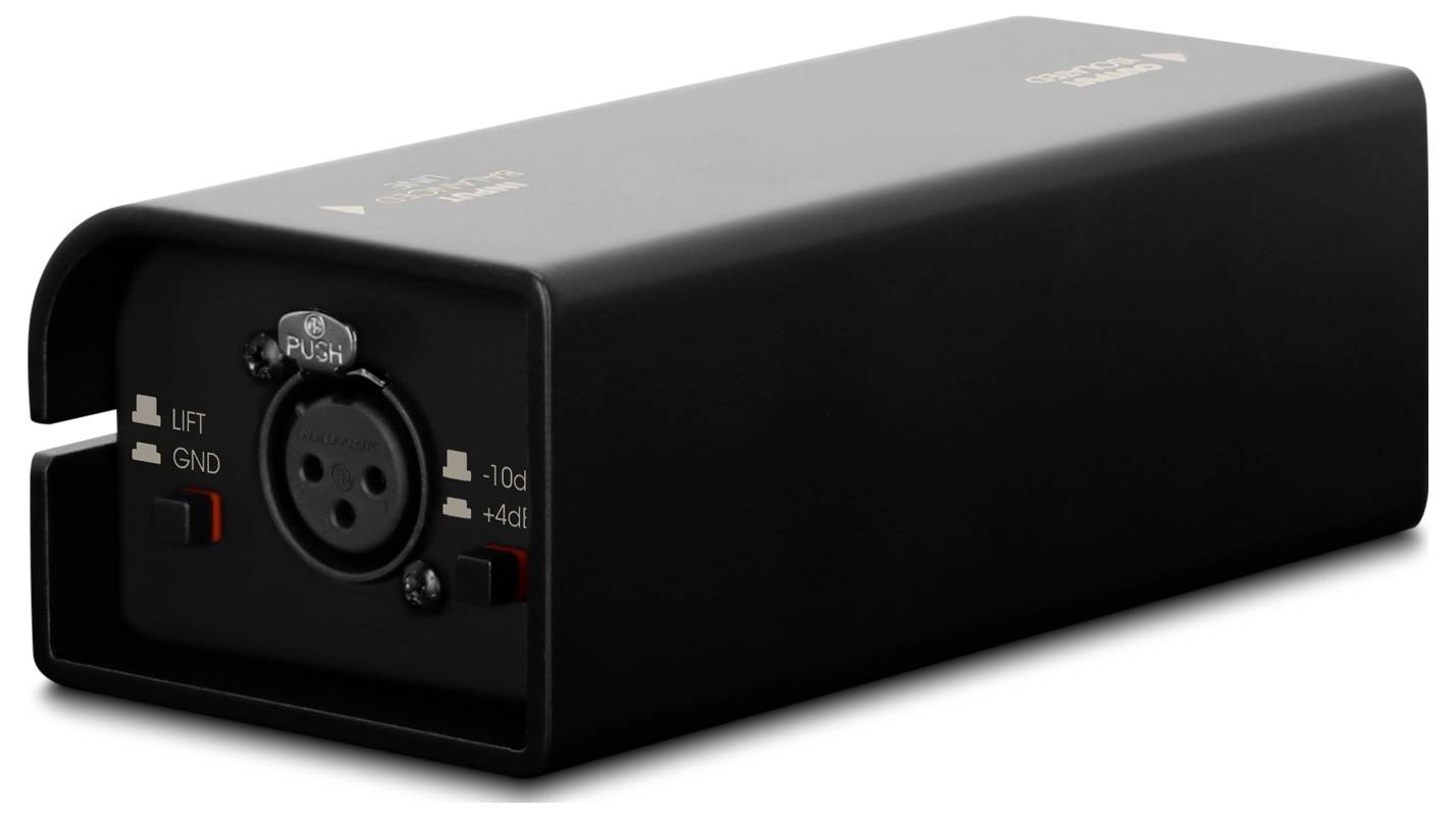 Appareil audio rectangulaire noir avec entrée XLR frontale, bouton de libération « Push », et commutateurs de levage/masse et de niveau.