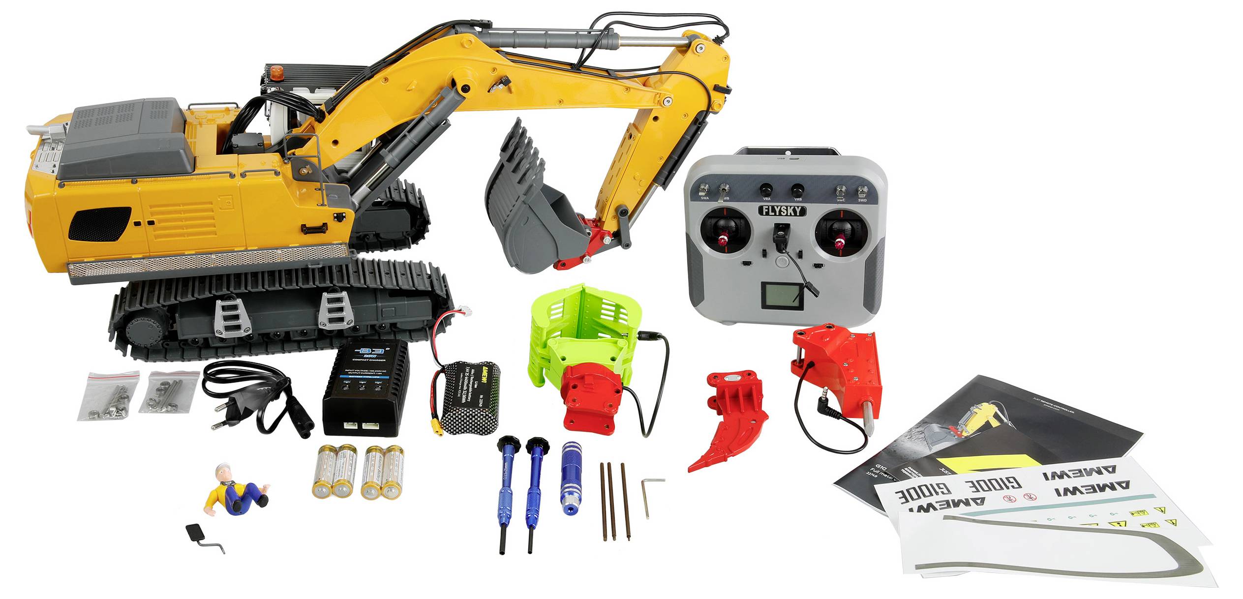 Kit de pelle excavatrice jaune téléguidée avec télécommande, piles, outils et pièces d'assemblage disposés sur un fond blanc.