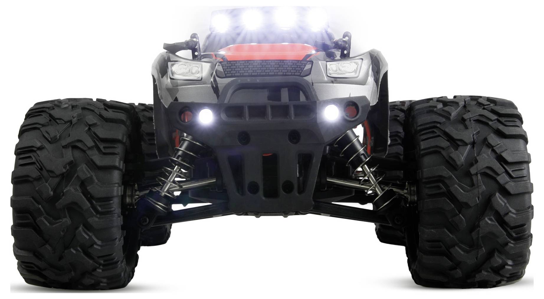 Vue de face d'un camion monstrueux RC tout-terrain avec des pneus surdimensionnés et des phares lumineux sur un fond blanc.