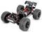 Châssis de buggy tout-terrain télécommandé avec de grands pneus à crampons, suspension visible, batterie et câblage sur fond blanc