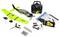 Kit d'avion radiocommandé avec avion modèle vert néon et gris, émetteur, hélices, batterie, chargeur, outils et manuels d'instructions disposés sur fond blanc