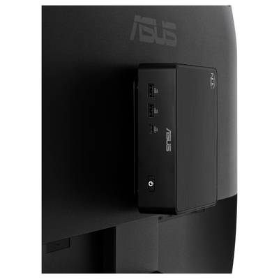 Gros plan d'un mini PC ASUS monté à l'arrière d'un moniteur, montrant les ports USB avant et un bouton d'alimentation.