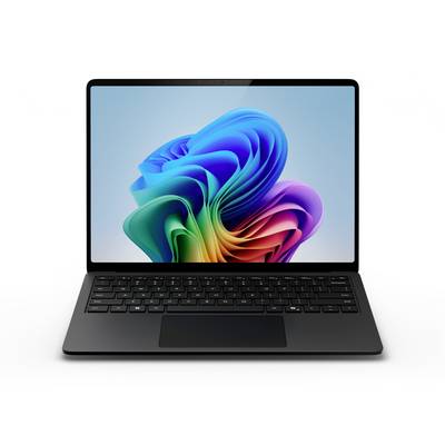 Un ordinateur portable noir avec un fond d'écran de fleur abstraite colorée sur son écran, montré ouvert sur un fond blanc.