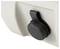 Gros plan d'un bouchon de torsion en plastique noir ou d'un bouton monté sur un panneau blanc, probablement un contrôle de machine ou un couvercle de port.
