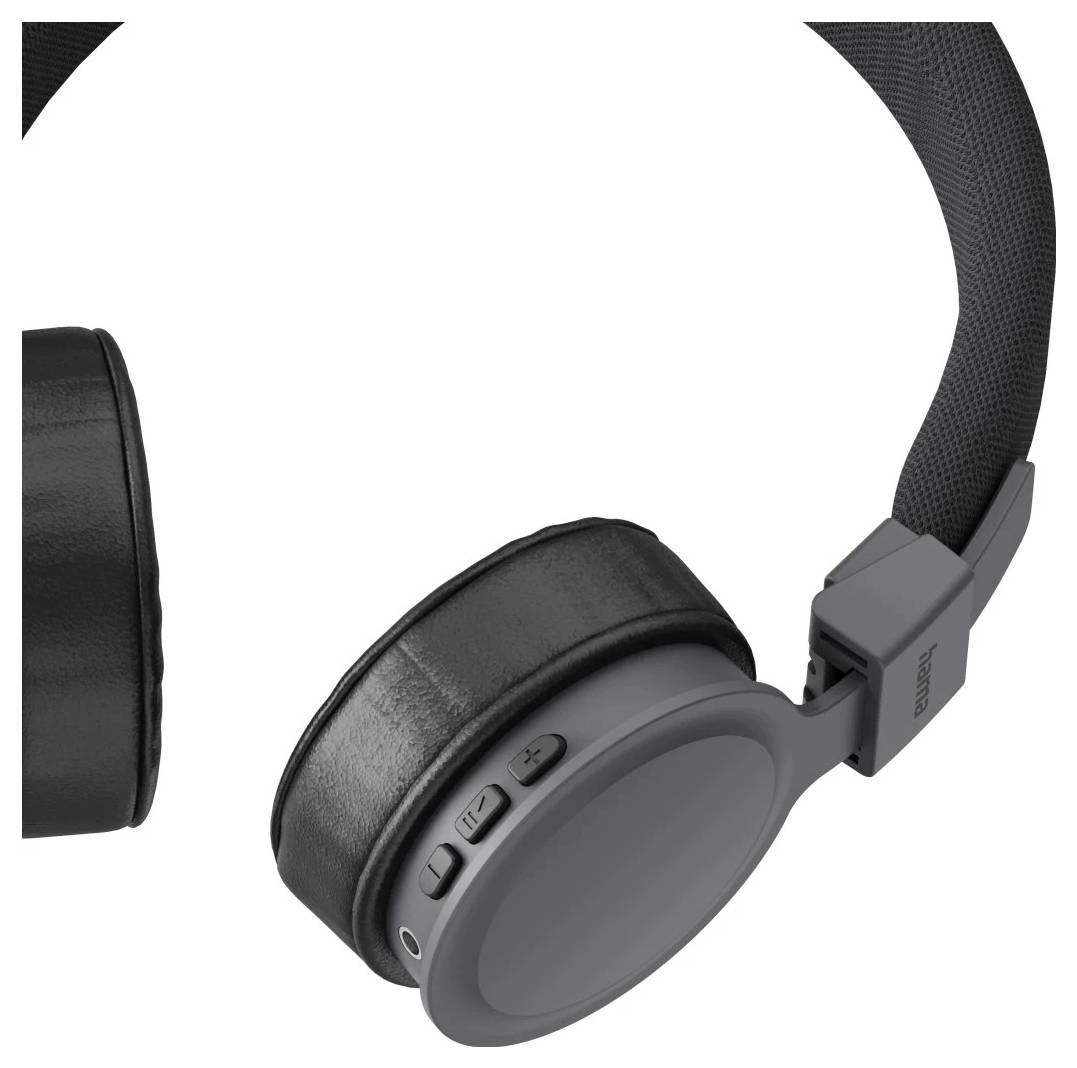 Casque audio supra-auriculaire noir présenté en gros plan sur un fond blanc, avec un écouteur centré et le serre-tête partiellement visible.