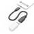 Câble adaptateur USB-C vers USB-A connecté à un smartphone, montrant un câble noir avec une prise USB-A blanche et une extrémité USB-C.