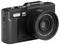 Appareil photo numérique compact noir avec objectif zoom de grande taille étiqueté « 5K Ultra HD » et « Objectif Zoom Numérique 18X » sur fond blanc