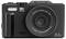 Appareil photo numérique compact noir vue de face étiqueté « 5K ULTRAHD », avec objectif zoom numérique 18x et texte « 75,0 MÉGAPIXELS ».