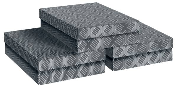 Trois coussins de mousse ou de matelas gris à motifs empilés les uns sur les autres avec une découpe en forme de U sur le devant, présentés sur un fond blanc.