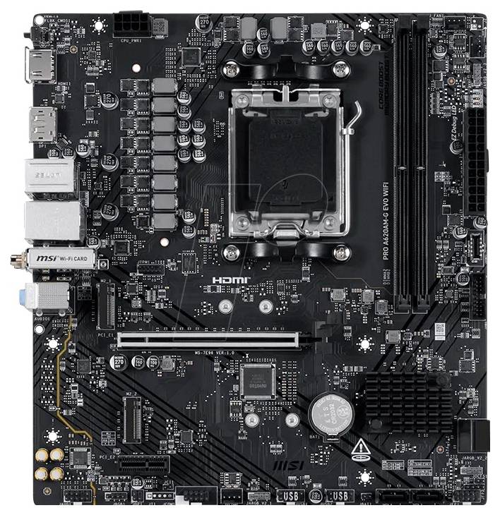 Vue de haut d'une carte mère d'ordinateur MSI noire avec socket CPU, emplacements RAM, emplacements PCIe, connecteurs de stockage et ports E/S arrière.