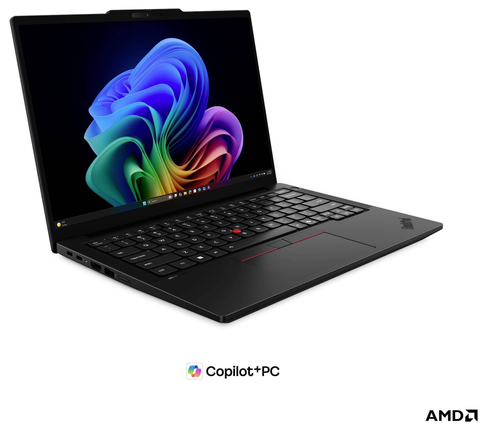 Un ordinateur portable Lenovo noir ouvert sur un fond blanc, affichant un fond d'écran abstrait coloré de style Windows avec les logos Copilot+ PC et AMD en dessous.