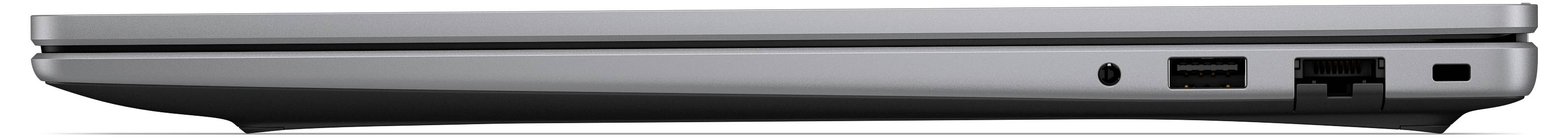 Vue latérale d'un ordinateur portable argenté fermé montrant un profil mince avec un port USB et d'autres connecteurs latéraux.