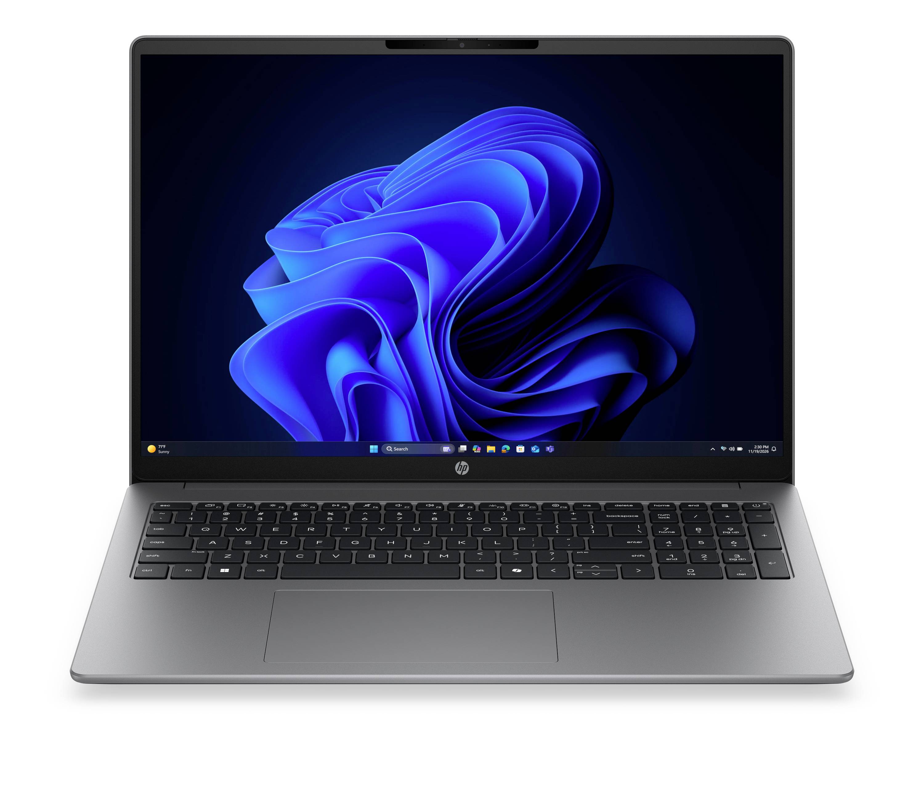 Vue de face d'un ordinateur portable argenté affichant un bureau Windows avec un fond d'écran bleu abstrait et un clavier/pavé tactile visible.