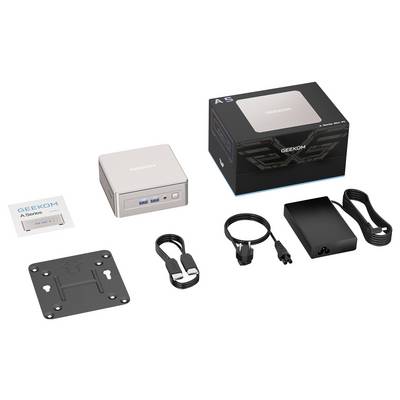 Image produit d'un mini PC GEEKOM avec sa boîte et les accessoires inclus : adaptateur d'alimentation, câble, plaque de montage et câble HDMI.