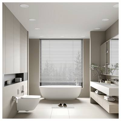 Salle de bain minimaliste moderne avec baignoire autoportante sous une fenêtre, toilettes murales, meuble-vasque et serviettes pliées; une paire de pantoufles repose sur le sol.