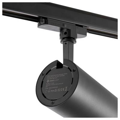 Projecteur cylindrique noir montés sur un rail de plafond, présenté en gros plan sur un fond blanc.