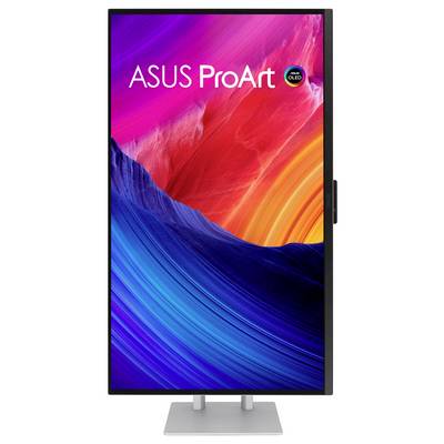 Moniteur ASUS ProArt OLED affichant une image abstraite colorée de vagues rouges, roses, oranges et bleues sur un socle argenté.