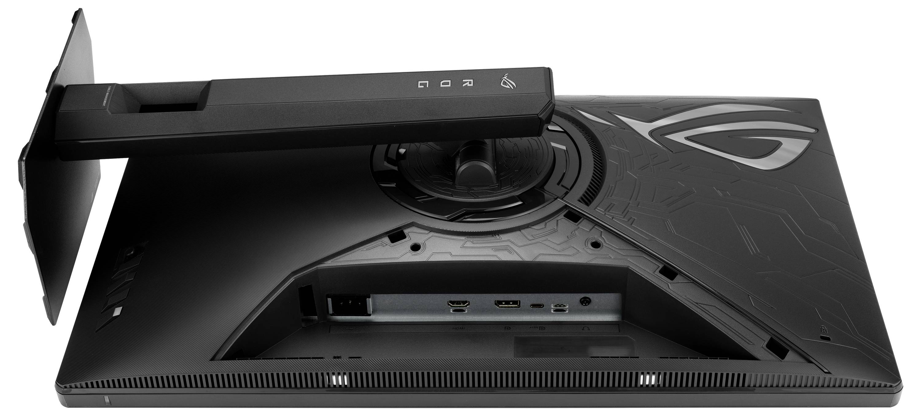 Vue arrière d'un moniteur de jeu ASUS ROG sur un support, montrant un concentrateur central de gestion des câbles et des ports E/S arrière avec le logo ROG sur le panneau arrière.