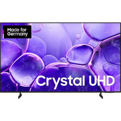 Publicité Smart TV avec des bulles en forme de cristal violet et les textes « Crystal UHD » et « Fabriqué pour l'Allemagne ».