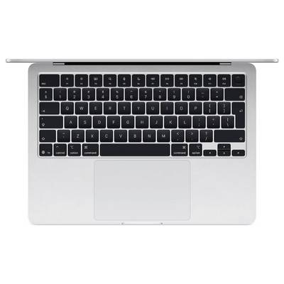 Vue de dessus d'un clavier d'ordinateur portable argenté avec un grand pavé tactile.