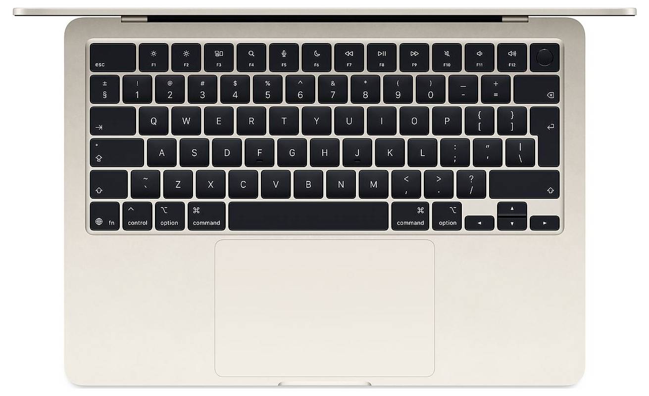 Vue de dessus d'un ordinateur portable argenté avec un clavier noir et un grand pavé tactile.