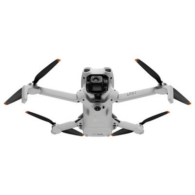 Vue de face d'un drone gris à quatre rotors avec quatre hélices et un cardan de caméra apparent, isolé sur un fond blanc.